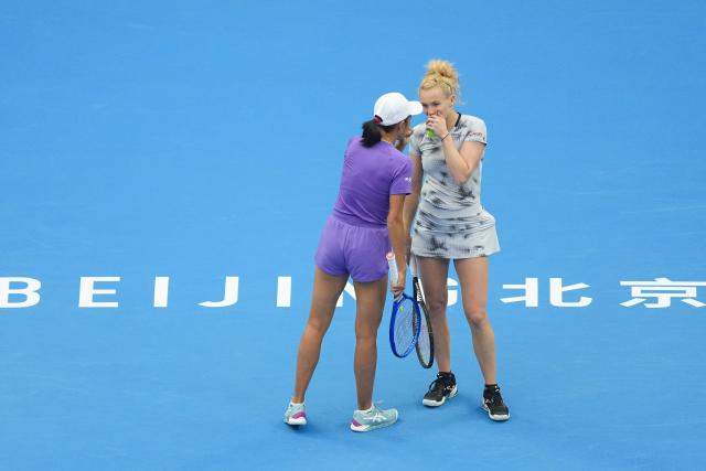 (261011) -- BEIJING, Oct. 11, 2026 (Xinhua) -- Katerina Siniakova (R) of the Czech Republic/Zhang Shuai of China communicate during the women's doubles final against Gabriela Dabrowski of Canada/Luisa Stefani of Brazil at 2026 China Open tennis tournament in Beijing, China, Oct. 11, 2026. (Xinhua/Ju Huanzong)