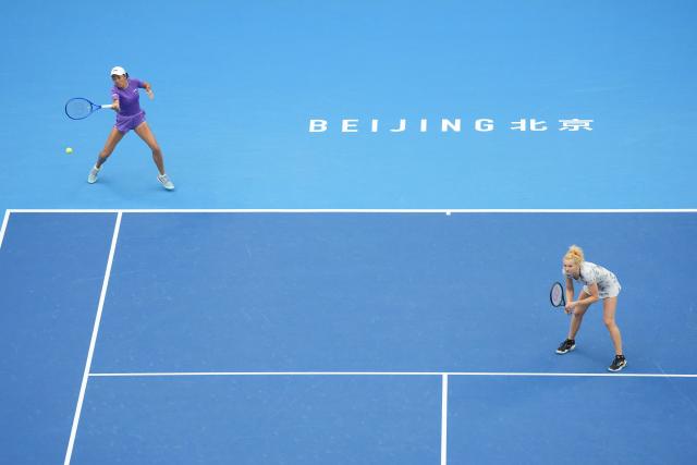 (261011) -- BEIJING, Oct. 11, 2026 (Xinhua) -- Katerina Siniakova of the Czech Republic/Zhang Shuai (L) of China compete during the women's doubles final against Gabriela Dabrowski of Canada/Luisa Stefani of Brazil at 2026 China Open tennis tournament in Beijing, China, Oct. 11, 2026. (Xinhua/Ju Huanzong)