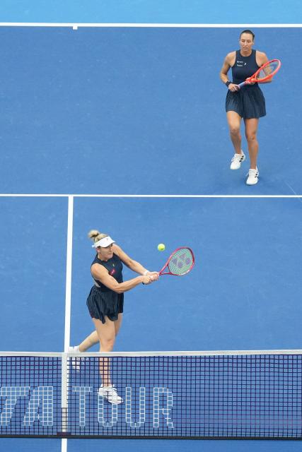 (261011) -- BEIJING, Oct. 11, 2026 (Xinhua) -- Gabriela Dabrowski (L) of Canada/Luisa Stefani of Brazil compete during the women's doubles final against Katerina Siniakova of the Czech Republic/Zhang Shuai of China at 2026 China Open tennis tournament in Beijing, China, Oct. 11, 2026. (Xinhua/Ju Huanzong)