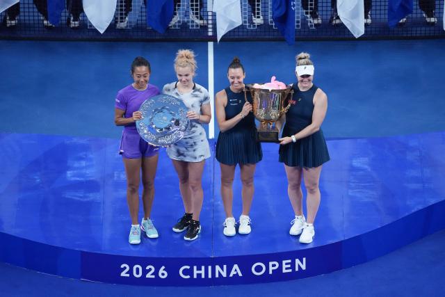 (261011) -- BEIJING, Oct. 11, 2026 (Xinhua) -- Winner Gabriela Dabrowski (1st R) of Canada/Luisa Stefani of Brazil pose with runner-up Katerina Siniakova (2nd L) of the Czech Republic/Zhang Shuai (1st L) of China during the awarding ceremony for the women's doubles at 2026 China Open tennis tournament in Beijing, China, Oct. 11, 2026. (Xinhua/Ju Huanzong)