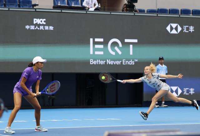 (261011) -- BEIJING, Oct. 11, 2026 (Xinhua) -- Katerina Siniakova (R) of the Czech Republic/Zhang Shuai compete during the women's doubles final against Gabriela Dabrowski of Canada/Luisa Stefani of Brazil at 2026 China Open tennis tournament in Beijing, China, Oct. 11, 2026. (Xinhua/Zhang Chenlin)