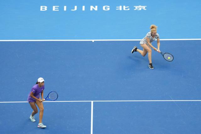(261011) -- BEIJING, Oct. 11, 2026 (Xinhua) -- Katerina Siniakova (R) of the Czech Republic/Zhang Shuai of China compete during the women's doubles final against Gabriela Dabrowski of Canada/Luisa Stefani of Brazil at 2026 China Open tennis tournament in Beijing, China, Oct. 11, 2026. (Xinhua/Ju Huanzong)
