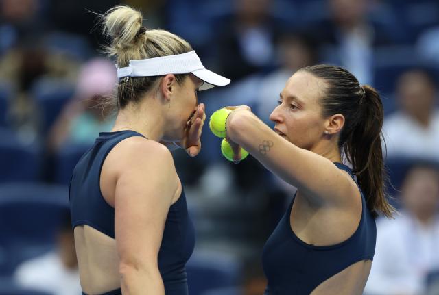 (261011) -- BEIJING, Oct. 11, 2026 (Xinhua) -- Gabriela Dabrowski (L) of Canada/Luisa Stefani of Brazil communicate during the women's doubles final against Katerina Siniakova of the Czech Republic/Zhang Shuai of China at 2026 China Open tennis tournament in Beijing, China, Oct. 11, 2026. (Xinhua/Zhang Chenlin)