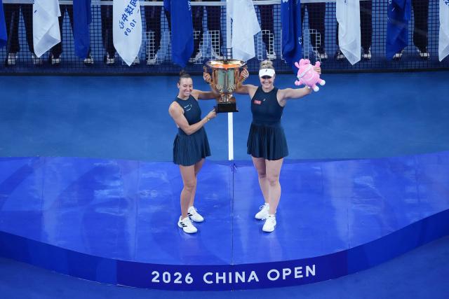(261011) -- BEIJING, Oct. 11, 2026 (Xinhua) -- Winner Gabriela Dabrowski (R) of Canada/Luisa Stefani of Brazil pose during the awarding ceremony for the women's doubles at 2026 China Open tennis tournament in Beijing, China, Oct. 11, 2026. (Xinhua/Ju Huanzong)