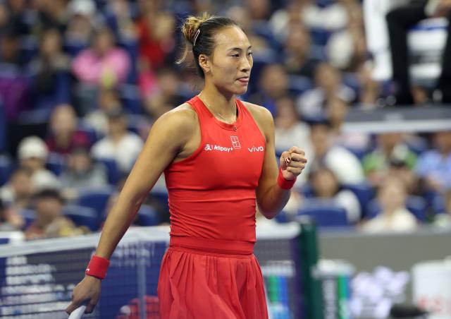 (261011) -- BEIJING, Oct. 11, 2026 (Xinhua) -- Zheng Qinwen celebrates scoring during the women's singles final between Zheng Qinwen of China and Mirra Andreeva of Russia at 2026 China Open tennis tournament in Beijing, China, Oct. 11, 2026. (Xinhua/Zhang Chenlin)