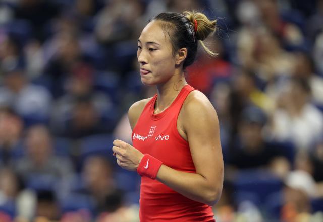 (261011) -- BEIJING, Oct. 11, 2026 (Xinhua) -- Zheng Qinwen celebrates scoring during the women's singles final between Zheng Qinwen of China and Mirra Andreeva of Russia at 2026 China Open tennis tournament in Beijing, China, Oct. 11, 2026. (Xinhua/Zhang Chenlin)