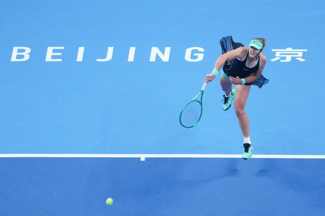 (261011) -- BEIJING, Oct. 11, 2026 (Xinhua) -- Mirra Andreeva serves during the women's singles final between Zheng Qinwen of China and Mirra Andreeva of Russia at 2026 China Open tennis tournament in Beijing, China, Oct. 11, 2026. (Xinhua/Ju Huanzong)