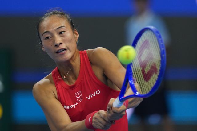 (261011) -- BEIJING, Oct. 11, 2026 (Xinhua) -- Zheng Qinwen hits a return during the women's singles final between Zheng Qinwen of China and Mirra Andreeva of Russia at 2026 China Open tennis tournament in Beijing, China, Oct. 11, 2026. (Xinhua/Sun Fei)