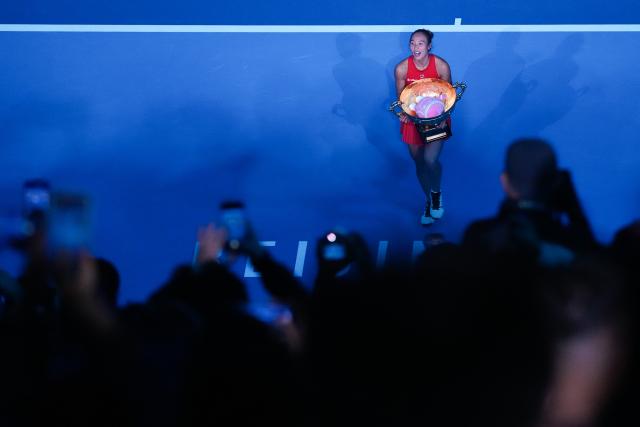 (261011) -- BEIJING, Oct. 11, 2026 (Xinhua) -- Zheng Qinwen poses with the trophy during the awarding ceremony after the women's singles final between Zheng Qinwen of China and Mirra Andreeva of Russia at 2026 China Open tennis tournament in Beijing, China, Oct. 11, 2026. (Xinhua/Ju Huanzong)