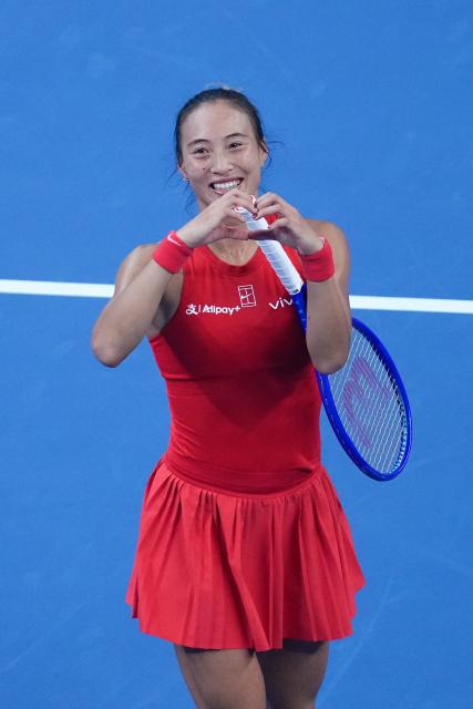 (261011) -- BEIJING, Oct. 11, 2026 (Xinhua) -- Zheng Qinwen reacts after the women's singles final between Zheng Qinwen of China and Mirra Andreeva of Russia at 2026 China Open tennis tournament in Beijing, China, Oct. 11, 2026. (Xinhua/Ju Huanzong)