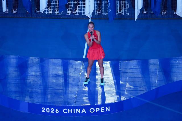 (261011) -- BEIJING, Oct. 11, 2026 (Xinhua) -- Zheng Qinwen sings during the awarding ceremony after the women's singles final between Zheng Qinwen of China and Mirra Andreeva of Russia at 2026 China Open tennis tournament in Beijing, China, Oct. 11, 2026. (Xinhua/Ju Huanzong)
