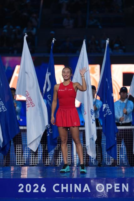 (261011) -- BEIJING, Oct. 11, 2026 (Xinhua) -- Zheng Qinwen waves during the awarding ceremony after the women's singles final between Zheng Qinwen of China and Mirra Andreeva of Russia at 2026 China Open tennis tournament in Beijing, China, Oct. 11, 2026. (Xinhua/Sun Fei)