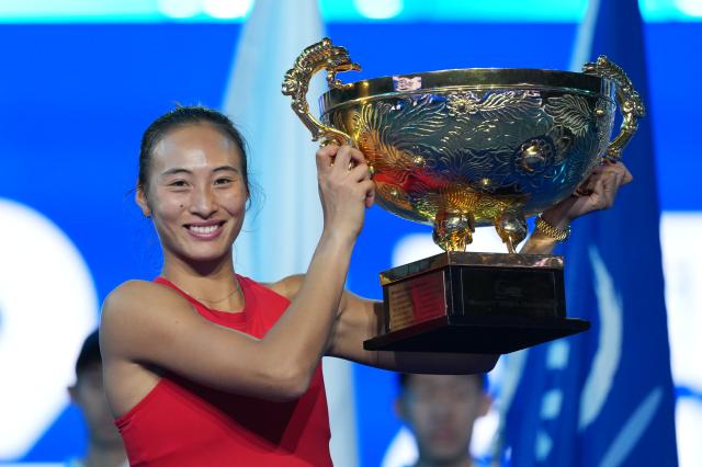 (261011) -- BEIJING, Oct. 11, 2026 (Xinhua) -- Zheng Qinwen poses with the trophy during the awarding ceremony after the women's singles final between Zheng Qinwen of China and Mirra Andreeva of Russia at 2026 China Open tennis tournament in Beijing, China, Oct. 11, 2026. (Xinhua/Sun Fei)
