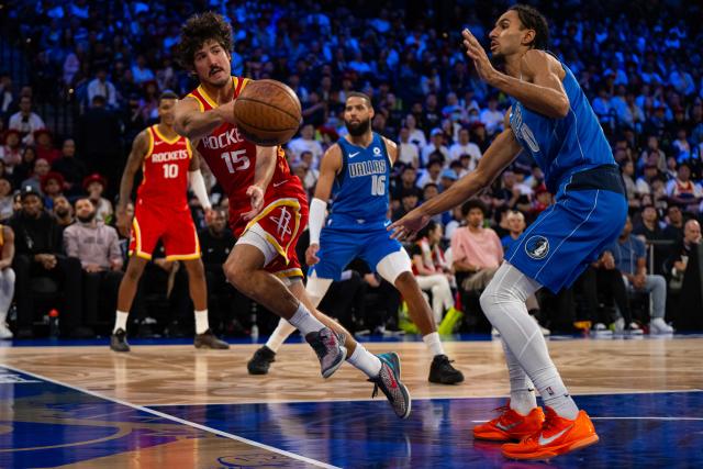 (261011) -- MACAO, Oct. 11, 2026 (Xinhua) -- Reed Sheppard (L) of Houston Rockets passes the ball during the 2026-2027 NBA preseason game between Dallas Mavericks and Houston Rockets in Macao, south China, on Oct. 11, 2026. (Xinhua/Cheong Kam Ka)