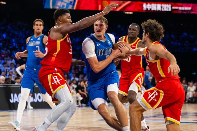 (261011) -- MACAO, Oct. 11, 2026 (Xinhua) -- Cooper Flagg (C) of Dallas Mavericks competes during the 2026-2027 NBA preseason game between Dallas Mavericks and Houston Rockets in Macao, south China, on Oct. 11, 2026. (Xinhua/Cheong Kam Ka)