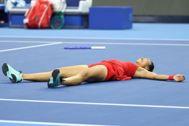 (261011) -- BEIJING, Oct. 11, 2026 (Xinhua) -- Zheng Qinwen celebrates victory after the women's singles final between Zheng Qinwen of China and Mirra Andreeva of Russia at 2026 China Open tennis tournament in Beijing, China, Oct. 11, 2026. (Xinhua/Zhang Chenlin)