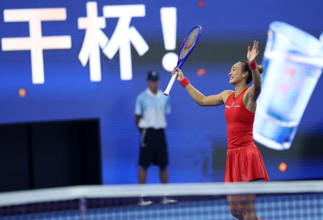 (261011) -- BEIJING, Oct. 11, 2026 (Xinhua) -- Zheng Qinwen greets the spectators after the women's singles final between Zheng Qinwen of China and Mirra Andreeva of Russia at 2026 China Open tennis tournament in Beijing, China, Oct. 11, 2026. (Xinhua/Zhang Chenlin)