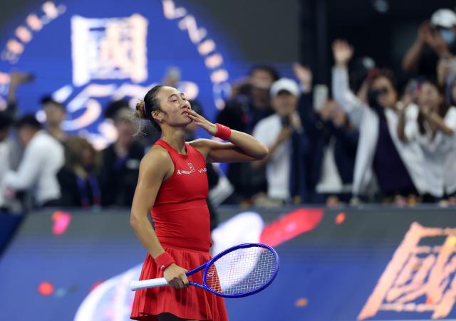(261011) -- BEIJING, Oct. 11, 2026 (Xinhua) -- Zheng Qinwen greets the spectators after the women's singles final between Zheng Qinwen of China and Mirra Andreeva of Russia at 2026 China Open tennis tournament in Beijing, China, Oct. 11, 2026. (Xinhua/Zhang Chenlin)