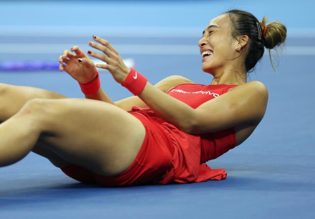 (261011) -- BEIJING, Oct. 11, 2026 (Xinhua) -- Zheng Qinwen celebrates victory after the women's singles final between Zheng Qinwen of China and Mirra Andreeva of Russia at 2026 China Open tennis tournament in Beijing, China, Oct. 11, 2026. (Xinhua/Zhang Chenlin)