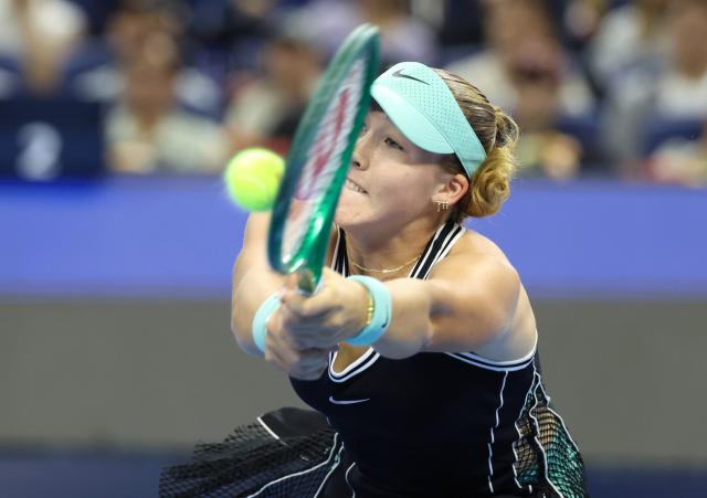 (261011) -- BEIJING, Oct. 11, 2026 (Xinhua) -- Mirra Andreeva hits a return during the women's singles final between Zheng Qinwen of China and Mirra Andreeva of Russia at 2026 China Open tennis tournament in Beijing, China, Oct. 11, 2026. (Xinhua/Zhang Chenlin)