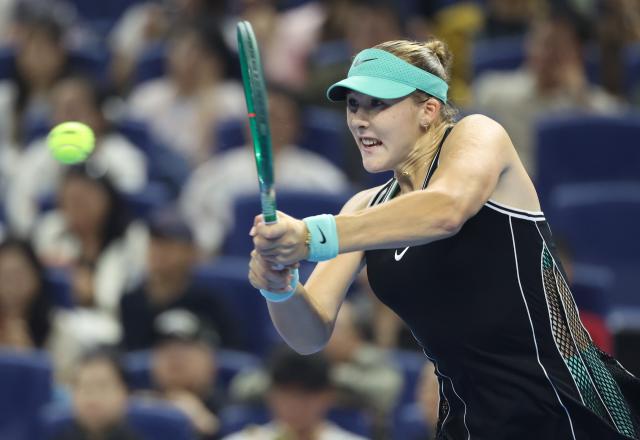 (261011) -- BEIJING, Oct. 11, 2026 (Xinhua) -- Mirra Andreeva hits a return during the women's singles final between Zheng Qinwen of China and Mirra Andreeva of Russia at 2026 China Open tennis tournament in Beijing, China, Oct. 11, 2026. (Xinhua/Zhang Chenlin)