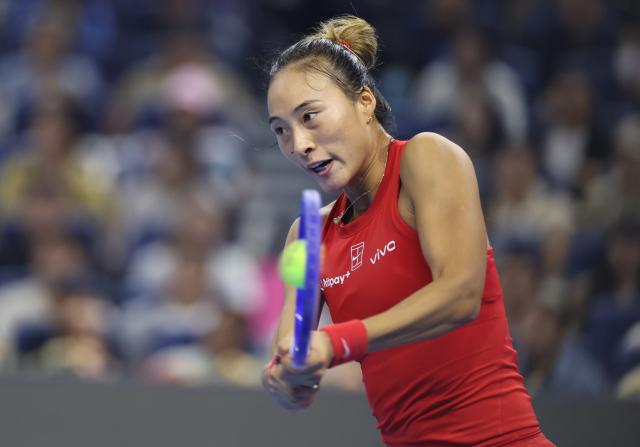 (261011) -- BEIJING, Oct. 11, 2026 (Xinhua) -- Zheng Qinwen hits a return during the women's singles final between Zheng Qinwen of China and Mirra Andreeva of Russia at 2026 China Open tennis tournament in Beijing, China, Oct. 11, 2026. (Xinhua/Zhang Chenlin)
