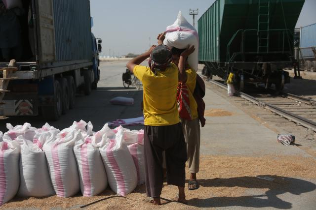 (261011) -- KABUL, Oct. 11, 2026 (Xinhua) -- Workers operate at loading area of Hairatan railway port in Balkh Province, northern Afghanistan, Sept. 17, 2026. TO GO WITH "Feature: Hairatan railway port emerges as trade hub linking Afghanistan to overseas markets" (Photo by Saifurahman Safi/Xinhua)