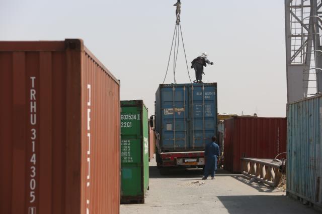 (261011) -- KABUL, Oct. 11, 2026 (Xinhua) -- Workers operate at loading area of Hairatan railway port in Balkh Province, northern Afghanistan, Sept. 17, 2026. TO GO WITH "Feature: Hairatan railway port emerges as trade hub linking Afghanistan to overseas markets" (Photo by Saifurahman Safi/Xinhua)