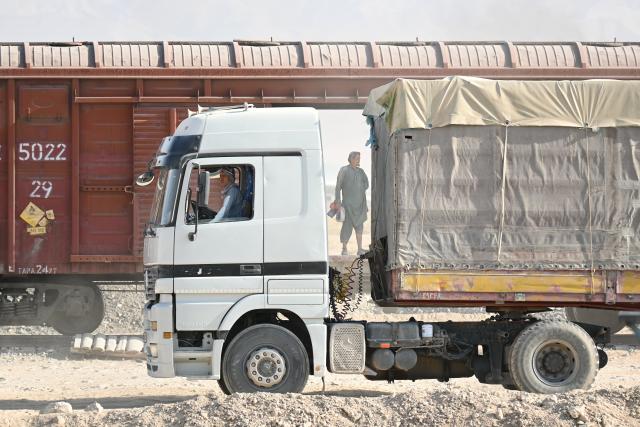 (261011) -- KABUL, Oct. 11, 2026 (Xinhua) -- Workers operate at loading area of Hairatan railway port in Balkh Province, northern Afghanistan, Sept. 17, 2026. TO GO WITH "Feature: Hairatan railway port emerges as trade hub linking Afghanistan to overseas markets" (Xinhua/Zhang Yibin)