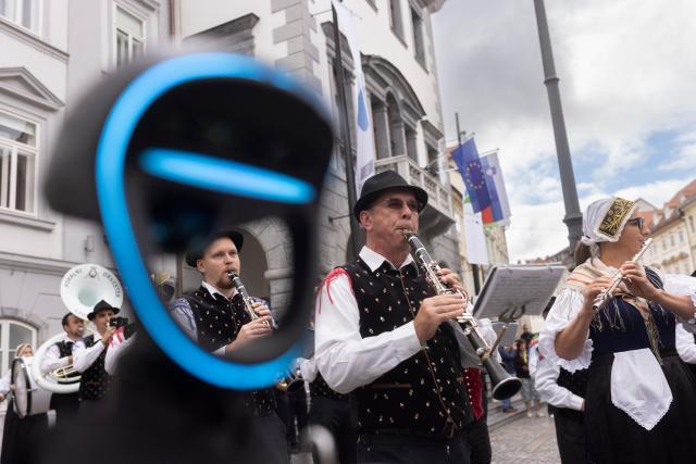(261011) -- LJUBLJANA, Oct. 11, 2026 (Xinhua) -- A Unitree G1 humanoid robot conducts the Ljubljana Wind Orchestra during the parade of the Ljubljana Wind Orchestra in Ljubljana, Slovenia, Oct. 11, 2026. (Photo by Zeljko Stevanic/Xinhua)
