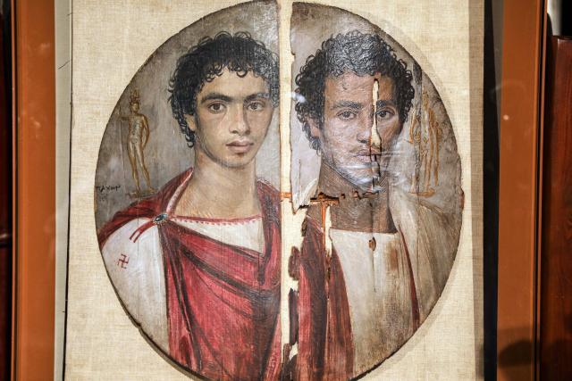 (261011) -- CAIRO, Oct. 11, 2026 (Xinhua) -- Photo taken on Oct. 11, 2026 shows the Tondo of the Two Brothers, an ancient Egyptian portrait from the Roman period, which will be displayed at Rome's Ara Pacis Museum, at a press conference in Cairo, Egypt. Egypt has restored the Tondo of the Two Brothers, an ancient Egyptian portrait from the Roman period that will be displayed outside the country for the first time, Egyptian Minister of Tourism and Antiquities Sherif Fathy announced Sunday. Fathy made the announcement at a press conference at the Egyptian Museum in Tahrir, Cairo, where the restored masterpiece was unveiled. It will be displayed at Rome's Ara Pacis Museum as part of the exhibition "The Power of the Portrait: Egypt and Rome, Faces of Fayum," running from Nov. 5, 2026, to May 2, 2027. (Xinhua/Ahmed Gomaa)