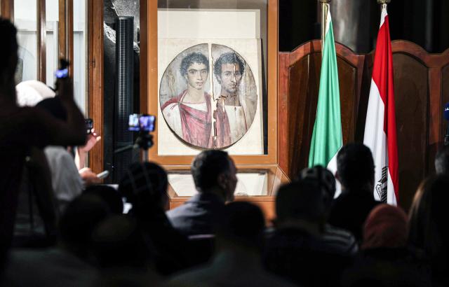 (261011) -- CAIRO, Oct. 11, 2026 (Xinhua) -- Photo taken on Oct. 11, 2026 shows the Tondo of the Two Brothers, an ancient Egyptian portrait from the Roman period, which will be displayed at Rome's Ara Pacis Museum, at a press conference in Cairo, Egypt. Egypt has restored the Tondo of the Two Brothers, an ancient Egyptian portrait from the Roman period that will be displayed outside the country for the first time, Egyptian Minister of Tourism and Antiquities Sherif Fathy announced Sunday. Fathy made the announcement at a press conference at the Egyptian Museum in Tahrir, Cairo, where the restored masterpiece was unveiled. It will be displayed at Rome's Ara Pacis Museum as part of the exhibition "The Power of the Portrait: Egypt and Rome, Faces of Fayum," running from Nov. 5, 2026, to May 2, 2027. (Xinhua/Ahmed Gomaa)