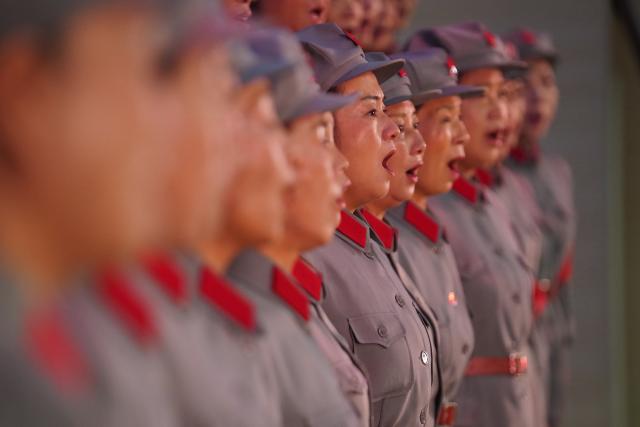 (261012) -- NANCHANG, Oct. 12, 2026 (Xinhua) -- The Long March Origin choir perform at a middle school in Yudu County, east China's Jiangxi Province, Sept. 3, 2026. This year marks the 90th anniversary of the victory of the Long March. As one of its important starting points, Yudu County in east China's Jiangxi Province, a place best known as the starting point of the Long March by the Central Red Army, the historic military maneuver in modern Chinese history, has become more than a place of remembrance.
   It was from Yudu that more than 80,000 Red Army soldiers crossed the Yudu River and began the Long March in 1934, the roughly 12,500-kilometer trek later described by American journalist Harrison Salisbury as "a great human epic."
   On the stone tablet in front of the memorial museum of the Central Red Army's departure for the Long March here in Yudu, three Chinese characters meaning "Long March Origin" are engraved. The "Long March Origin" not only indicates that this place was the starting point of the important strategic transfer of the Red Army at that time, but also carries the profound understanding of the Long March spirit by the people of Yudu to this day.
   You can see the words "Long March Origin" frequently in Yudu, and the Long March Origin choir is a prominent presence.
   In this red revolutionary land of Yudu, almost everyone can share family stories connected to the Red Army's Long March. The Long March Origin choir, established in 2010, is composed of over 100 descendants of Red Army soldiers from all walks of life in the county. Over these years, they have not only performed the "Suite of Songs on the Long March" in Yudu and across Jiangxi in their spare time, but also carried forward the spirit of the Long March along the Long March route with their songs.
   The choir's first performance was staged on June 30, 2011, which was dedicated to the 90th anniversary of the founding of the Communist Party of China. So far the choir has performed over 730 charity performances. "We hope that the choir will complete 1,000 performances by the 100th anniversary of the victory of the Long March," said Zou Weimin, the director of the choir. (Xinhua/Zhou Mi)