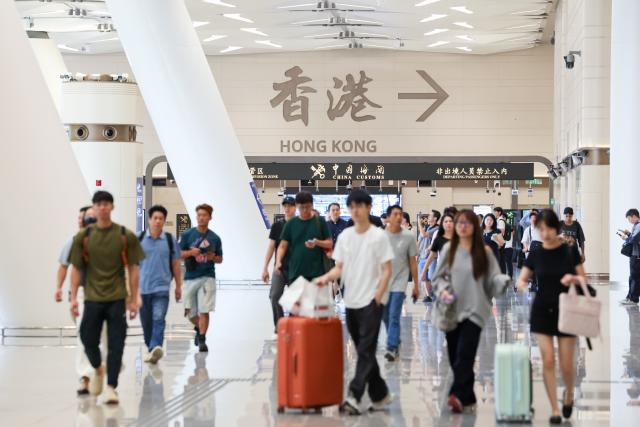 (261012) -- SHENZHEN, Oct. 12, 2026 (Xinhua) -- Passengers leave for Hong Kong via the Huanggang Port in Shenzhen, south China's Guangdong Province, Oct. 12, 2026. The redeveloped Huanggang Port opened at 6:30 a.m. (local time) on Monday, streamlining cross-border passenger travel between China's Shenzhen and Hong Kong Special Administrative Region. (Xinhua/Liang Xu)