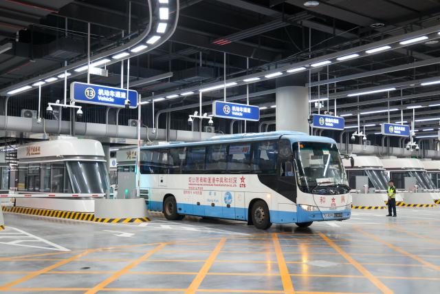(261012) -- SHENZHEN, Oct. 12, 2026 (Xinhua) -- A bus enters Shenzhen via the Huanggang Port in south China's Guangdong Province, Oct. 12, 2026. The redeveloped Huanggang Port opened at 6:30 a.m. (local time) on Monday, streamlining cross-border passenger travel between China's Shenzhen and Hong Kong Special Administrative Region. (Xinhua/Liang Xu)