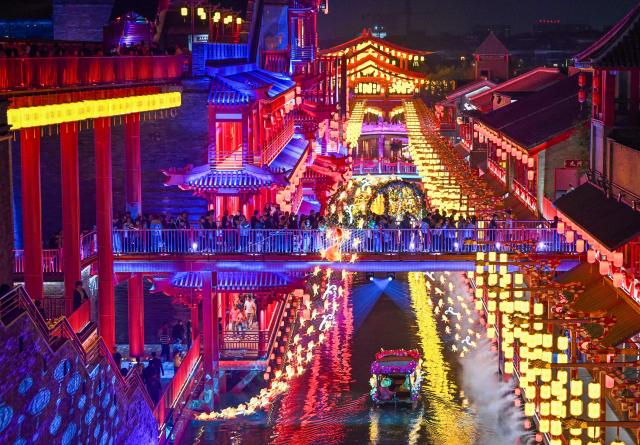 (261012) -- TIANJIN, Oct. 12, 2026 (Xinhua) -- People visit the Eastern Acropolis in Binhai New Area of Tianjin, north China, Oct. 11, 2026. Eastern Acropolis, a cultural and tourism complex in Beitang ancient town of Tianjin, launched its trial operation on Sunday. The complex, built upon the town's original infrastructure and themed on Tianjin's history and culture, offers immersive performances, cultural experiences, specialty stores and leisure options for visitors. (Xinhua/Zhao Zishuo)