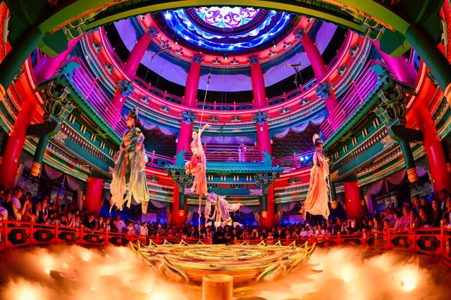 (261012) -- TIANJIN, Oct. 12, 2026 (Xinhua) -- Visitors watch a performance at the Eastern Acropolis in Binhai New Area of Tianjin, north China, Oct. 11, 2026. Eastern Acropolis, a cultural and tourism complex in Beitang ancient town of Tianjin, launched its trial operation on Sunday. The complex, built upon the town's original infrastructure and themed on Tianjin's history and culture, offers immersive performances, cultural experiences, specialty stores and leisure options for visitors. (Xinhua/Zhao Zishuo)