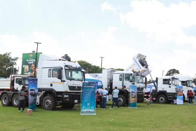 (261012) -- HARARE, Oct. 12, 2026 (Xinhua) -- Trucks are displayed at the China-Zimbabwe Commodity Expo and Job Fair in Harare, Zimbabwe, on Oct. 9, 2026. Chinese heavy-duty truck brands attracted strong interest from visitors at the three-day China-Zimbabwe Commodity Expo and Job Fair, which concluded Sunday in the Zimbabwean capital of Harare, reflecting growing local demand for reliable commercial vehicles.
   TO GO WITH "Chinese trucks roll into spotlight at Zimbabwe expo" (Photo by Tafara Mugwara/Xinhua)