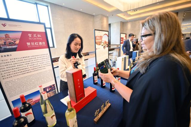 (261012) -- YINCHUAN, Oct. 12, 2026 (Xinhua) -- A foreign guest learns about Ningxia's wine during the opening ceremony of the 47th World Congress of Vine and Wine in Yinchuan, northwest China's Ningxia Hui Autonomous Region, Oct. 12, 2026. The 47th World Congress of Vine and Wine opened on Monday in Yinchuan, capital of northwest China's Ningxia Hui Autonomous Region, China's top wine-producing area.
  This is the first time the congress, held alongside the 24th General Assembly of the International Organization of Vine and Wine (OIV), has been hosted in Asia since its launch in 1924.
  The event has drawn more than 800 participants, including delegates from 51 OIV member states, diplomatic envoys to China from 25 countries, representatives from 47 countries and international organizations, leading experts and scholars in the wine sector from at home and abroad, as well as heads of domestic business associations and leading enterprises. (Xinhua/Wang Peng)
