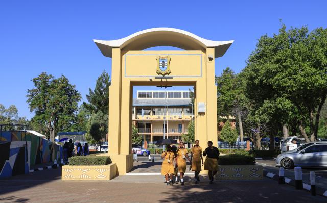 (261012) -- GABORONE, Oct. 12, 2026 (Xinhua) -- People walk on a street in Gaborone, Botswana, Oct. 9, 2026. Gaborone, the capital and the largest city of Botswana, serves as the country's political, economic, cultural and financial center. (Xinhua/Chen Wei)