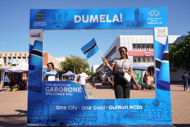 (261012) -- GABORONE, Oct. 12, 2026 (Xinhua) -- A woman poses for photos at a photo spot for the World Athletics Relays in Gaborone, Botswana, May 3, 2026. Gaborone, the capital and the largest city of Botswana, serves as the country's political, economic, cultural and financial center. (Xinhua/Yang Guang)