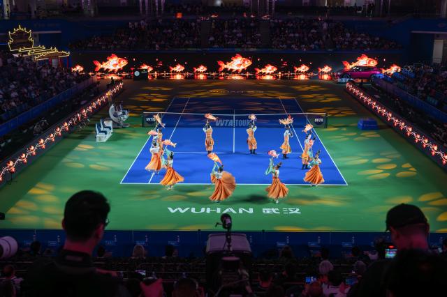 (261012) -- WUHAN, Oct. 12, 2026 (Xinhua) -- Dancers perform during the opening ceremony of the 2026 Wuhan Open tennis tournament in Wuhan, capital of central China's Hubei Province, Oct. 12, 2026. (Xinhua/Du Zixuan)