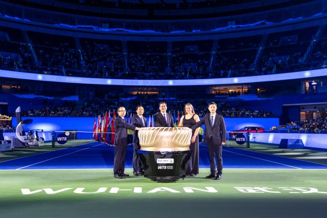 (261012) -- WUHAN, Oct. 12, 2026 (Xinhua) -- Jelena Ostapenko (2nd R) of Latvia attends the opening ceremony of the 2026 Wuhan Open tennis tournament in Wuhan, capital of central China's Hubei Province, Oct. 12, 2026. (Xinhua/Xiao Yijiu)