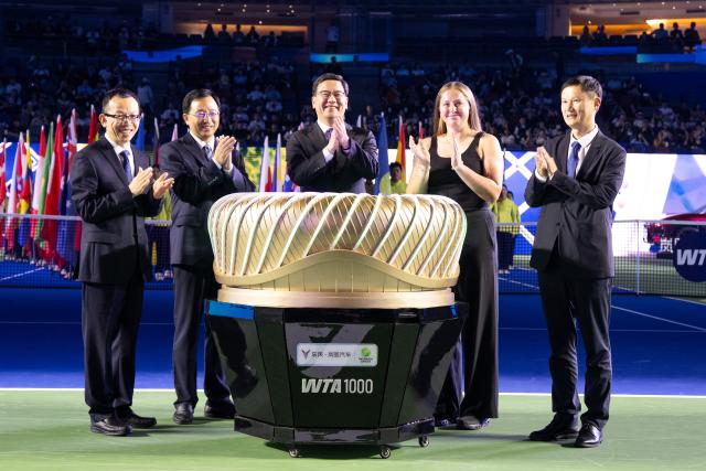 (261012) -- WUHAN, Oct. 12, 2026 (Xinhua) -- Jelena Ostapenko (2nd R) of Latvia attends the opening ceremony of the 2026 Wuhan Open tennis tournament in Wuhan, capital of central China's Hubei Province, Oct. 12, 2026. (Xinhua/Xiao Yijiu)