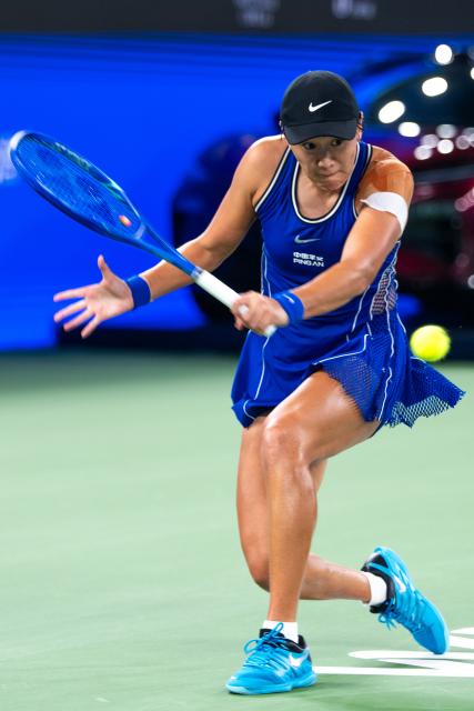 (261012) -- WUHAN, Oct. 12, 2026 (Xinhua) -- Wang Xiyu hits a return during the women's sinlges round of 64 match between Wang Xiyu of China and Wang Xinyu of China of the 2026 Wuhan Open tennis tournament in Wuhan, capital of central China's Hubei Province, Oct. 12, 2026. (Xinhua/Xiao Yijiu)