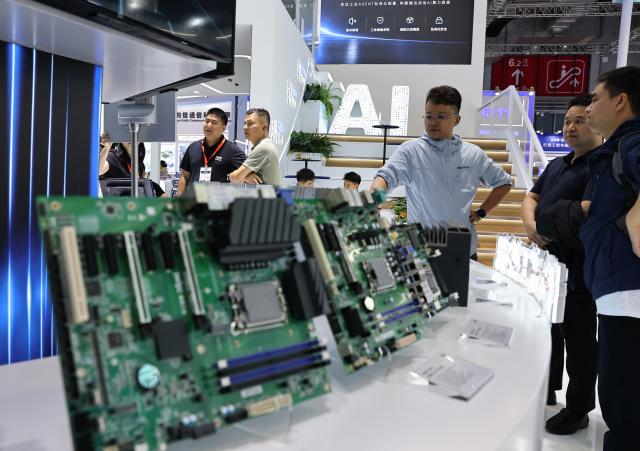 (261012) -- SHANGHAI, Oct. 12, 2026 (Xinhua) -- People visit the 26th China International Industry Fair (CIIF) in east China's Shanghai, Oct. 12, 2026. The 26th CIIF kicked off here on Monday, with the theme of "Intelligent Economy, Limitless Smart Manufacturing." (Xinhua/Fang Zhe)