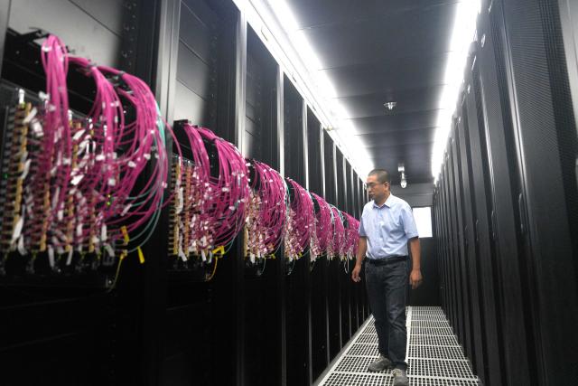 (261012) -- BEIJING, Oct. 12, 2026 (Xinhua) -- This photo provided by iSoftStone Information Technology (Group) Co., Ltd. shows a scene inside a token factory at the Beijing Economic-Technological Development Area in Beijing, capital of China, Sept. 21, 2026. TO GO WITH "Economic Watch: China rolls out 'token factories' to drive AI economy" (Xinhua)