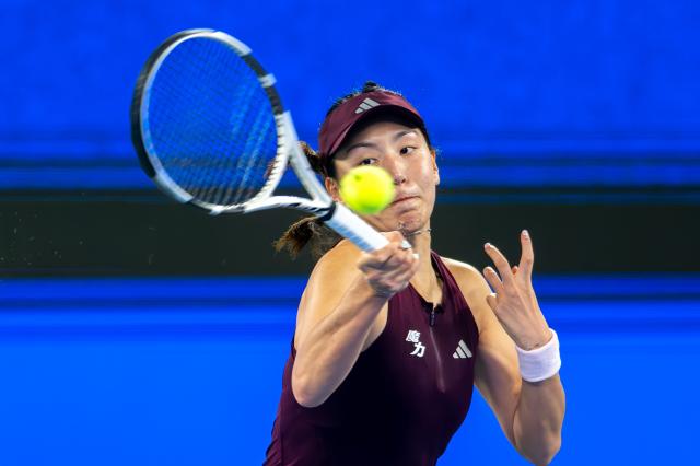 (261012) -- WUHAN, Oct. 12, 2026 (Xinhua) -- Wang Xinyu hits a return during the women's sinlges round of 64 match between Wang Xiyu of China and Wang Xinyu of China of the 2026 Wuhan Open tennis tournament in Wuhan, capital of central China's Hubei Province, Oct. 12, 2026. (Xinhua/Du Zixuan)