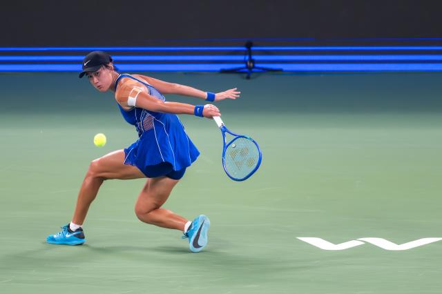 (261012) -- WUHAN, Oct. 12, 2026 (Xinhua) -- Wang Xiyu hits a return during the women's sinlges round of 64 match between Wang Xiyu of China and Wang Xinyu of China of the 2026 Wuhan Open tennis tournament in Wuhan, capital of central China's Hubei Province, Oct. 12, 2026. (Xinhua/Du Zixuan)