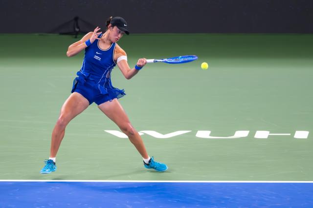 (261012) -- WUHAN, Oct. 12, 2026 (Xinhua) -- Wang Xiyu hits a return during the women's sinlges round of 64 match between Wang Xiyu of China and Wang Xinyu of China of the 2026 Wuhan Open tennis tournament in Wuhan, capital of central China's Hubei Province, Oct. 12, 2026. (Xinhua/Du Zixuan)